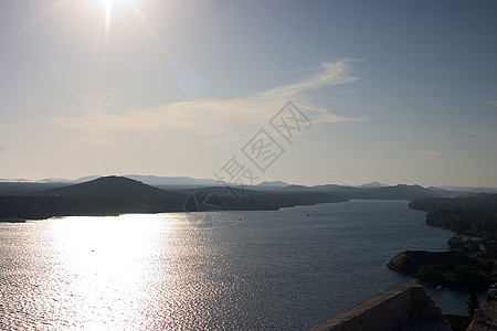 太阳蓝色波浪绿色地景海滩图片