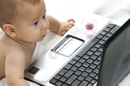 婴儿膝上型电脑童年姿势孩子儿童白色笔记本技术男生冒充壮年图片
