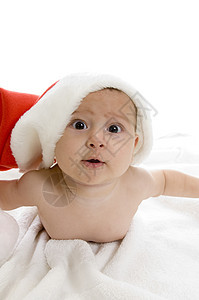 长着圣诞树帽躺着的可爱婴儿图片