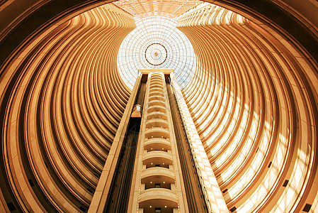 电梯建筑晴天建筑学富裕天空太阳卷轴酒店圆柱财富图片