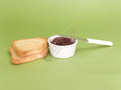 果酱 吐司和刀子红色早餐食物绿色宏观面包水果图片
