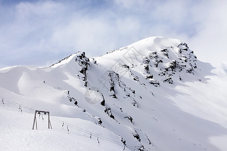 山丘和雪雪旅游冻结阳光闲暇远足太阳冰川爬坡登山蓝色图片