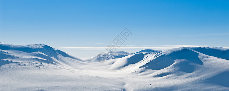 白雪山地全景白色季节性蓝色风景晴天季节山脉天空越野图片