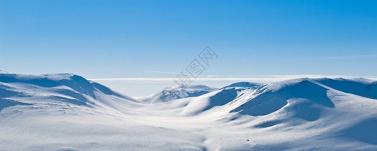 白雪山地全景白色季节性蓝色风景晴天季节山脉天空越野背景图片