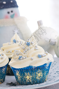 圣诞纸杯蛋糕饮食烘烤食物派对玩意儿奶油甜点蓝色家庭玩具图片