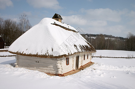 雪下旧农村小屋背景图片
