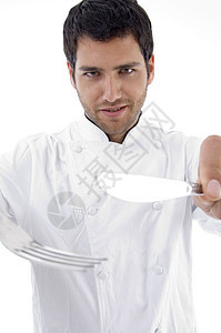 男性厨师拿着餐具的肖像图片