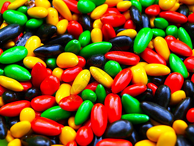 糖果红色绿色甜点食物黑色黄色背景图片