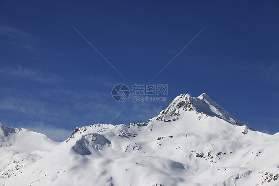 下雪山脉太阳高度高山运动滑雪阴霾蓝色单板冻结暴风雪图片