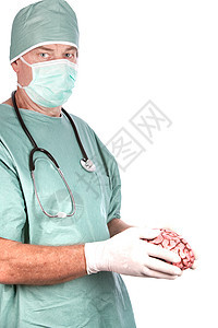 男性外科医生持有大脑药品医疗保健面具手术卫生男人白色绿色图片
