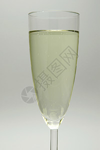 闪耀的葡萄酒瓶子饮料酒精白色派对黑色眼镜长笛玻璃庆典背景图片