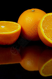 橙子橘子水果黑色食物背景图片