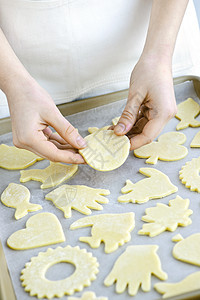 用 cookie 烘烤工作表烹饪面团托盘女士手指糖果款待床单食物推杆图片