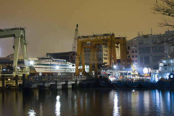 码头贸易建筑起重机船运送货城市橙子货物海洋商业图片