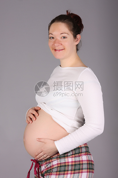 怀孕孕妇的肚子婴儿女孩妈妈父母生活工作室成人女性身体母性图片