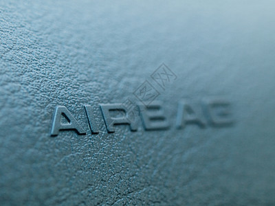 气袋宏观皮革蓝色黑色运输汽车标签车辆安全驾驶背景图片