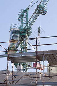 建筑工地住房建造工程起重机商业工业构造蓝色框架脚手架图片