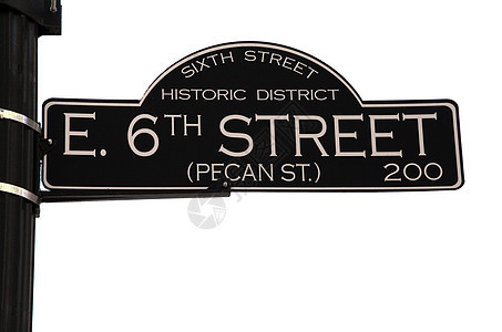 奥斯汀德克萨斯州第六街历史性胡桃路标派对街道背景图片