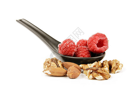 冰冻的兰草莓 在有坚果的勺子上食物饮食红色产品小吃白色味道营养粉色美食图片
