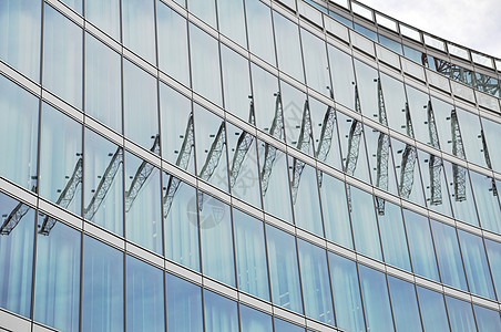 现代建筑玻璃反光镜房子建筑学城市办公室公司摩天大楼起重机青色商业景观图片