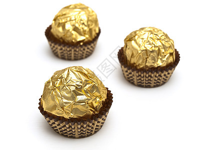 松露糖果金子黄色巧克力奶糖团体甜点图片