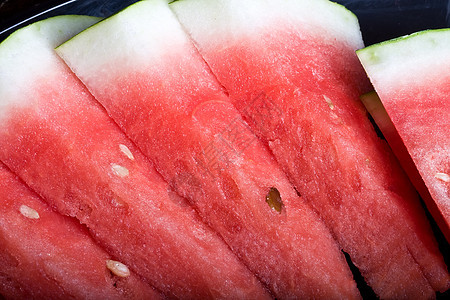 西瓜季节性红色白色食物小吃绿色种子活力热带果汁图片