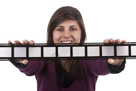 持有电影照片框的年轻女子 在白色后腹号上被孤立眼镜记忆女士相机摄影框架商业女孩微笑女性图片