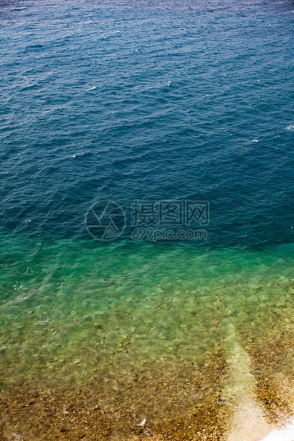 海洋背景岩石旅行海岸线支撑石头热带蓝色假期海浪海滩图片