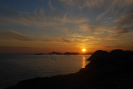 日落橙子砂石太阳悬崖反射流动天堂波浪旅游海岸图片