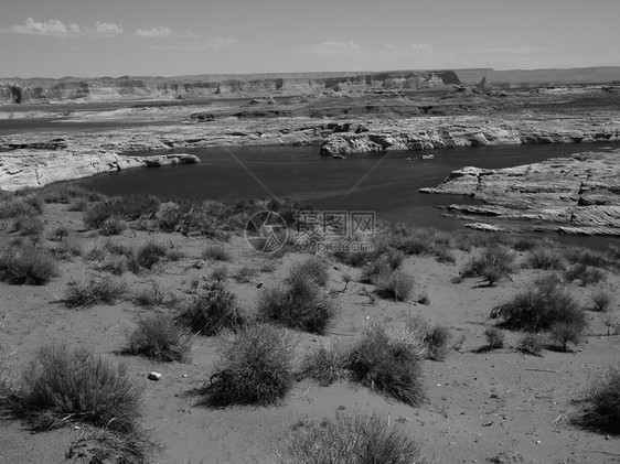 亚利桑那州鲍威尔湖娱乐海浪日落岩石砂岩旅行天空公园台面反射图片