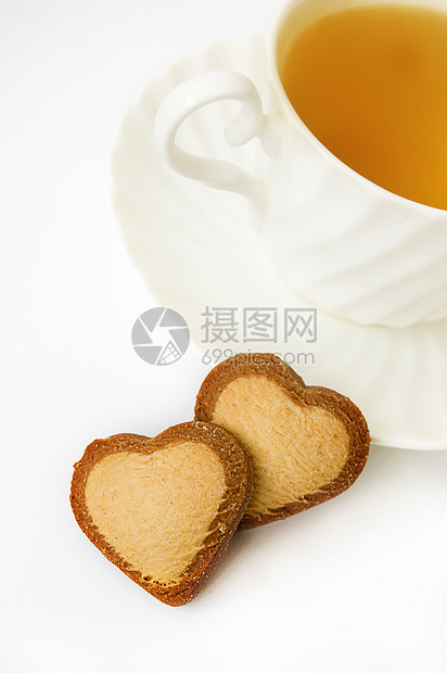 绿茶和心形饼干绿色可可食物黄油小吃白色杯子早餐图片
