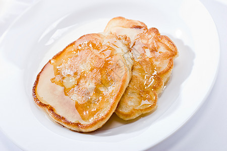 带蜂蜜的煎饼盘子软泥早餐午餐饼子油炸食物耳光糖浆图片