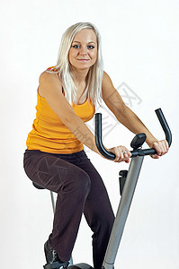 自行车健身女士有氧运动娱乐训练机器踏板运动女性化背景图片