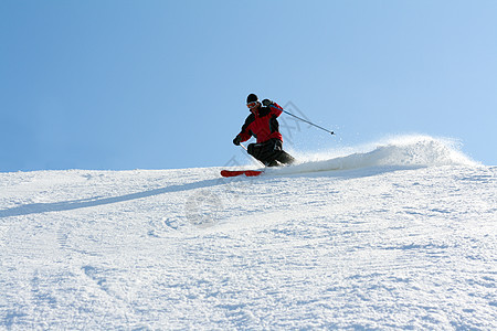 男子在山上滑雪男性衣服速度优胜者滑雪者下坡运动冻结蓝色旅行图片