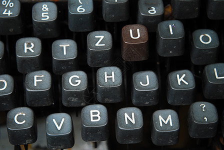 旧式打字机键盘机器金属工作新闻业古董钥匙报纸黑色圆形图片