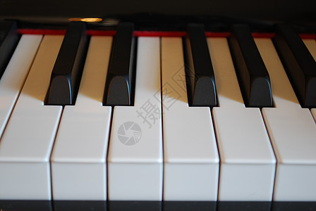 钢琴键音乐家钥匙歌曲乌木娱乐爵士乐笔记白色音乐艺术图片