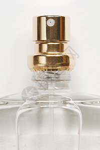 特写化妆喷雾喷嘴液体喷雾器玻璃香味化妆品瓶子香水背景图片