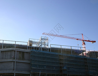 建筑工地起重机城市机器蓝色构造工作天空梯子工人建筑学安全图片