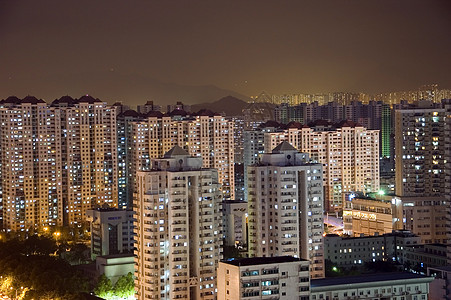 现代城市在夜里变色公寓建筑物房地产景观住宅日落夜景城市化图片