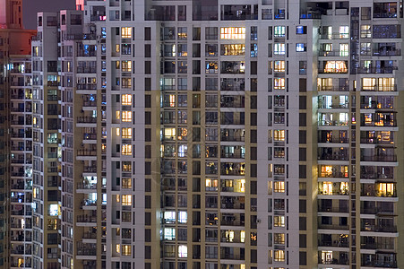 住宅楼在夜间前房子阳台日落面板建筑物景观夜景住房城市化居住图片