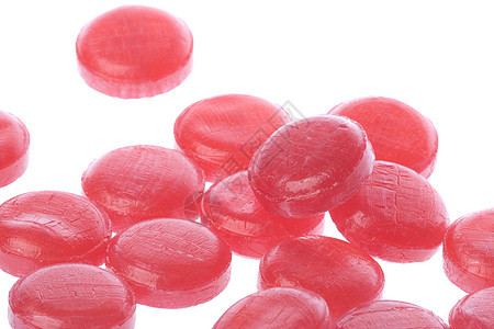 孤立的糖果红色粉色食物宏观刺激糖衣大枣背景图片