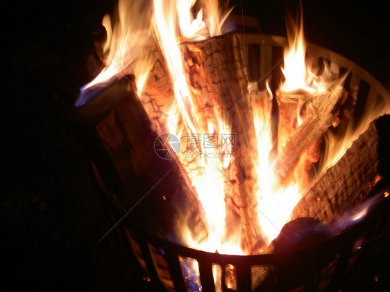 火焰之光辉光烧伤燃烧木头壁炉营火图片