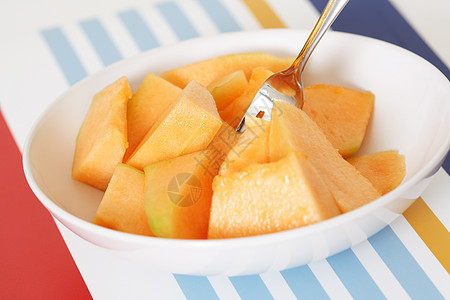 坎塔罗普切片橙子食物营养皮肤水果盘子果皮黄色图片