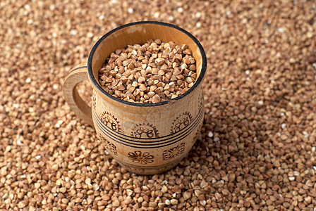 木制杯中的小麦植物盘子营养宏观核心饮食杯子种子粮食玉米图片