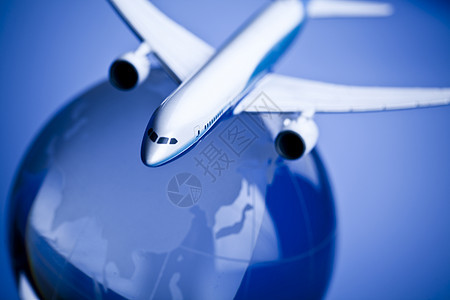 蓝色背景的地球航空班机圆形飞机场移民运输插图圆圈世界飞机旅行航班背景图片