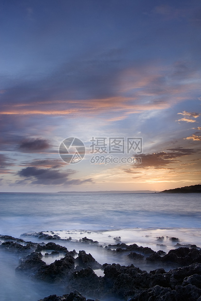 珊瑚礁海岸线的日落石头岩石天堂海浪太阳日出海景旅游天空珊瑚图片