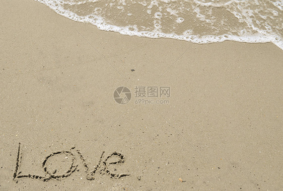 爱在沙沙中与海浪一起写作贝壳海滩泡沫海洋电子岩石图片