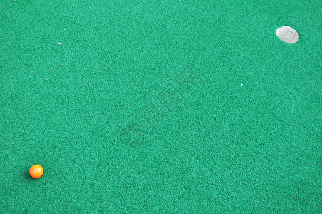 迷性高尔夫背景草皮人工高尔夫球推介会橙子绿色运动推杆图片