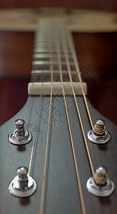 吉他脖子和弦软焦点乐器细绳金属娱乐笔记音乐旋律木头音乐家绳索图片