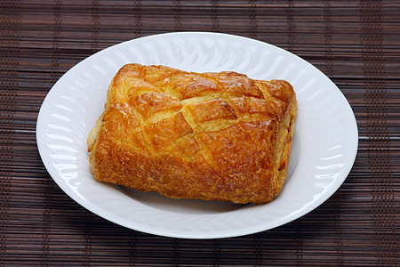 盘子上好吃的面包包棕色面包白色金子糕点咖啡美食飞碟脆弱性食物图片